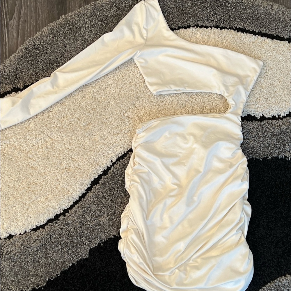 White one sleeve, side cut out runched spandex dress.